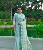 Teal woven raw silk saree with blouse