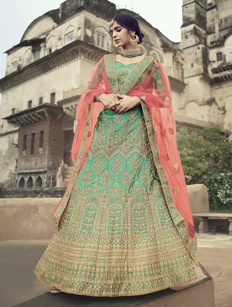 Green glitter dori, zari and thread embroidered with stone work satin semi stitched lehenga