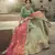 Green glitter dori, zari and thread embroidered with stone work satin semi stitched lehenga