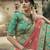 Green glitter dori, zari and thread embroidered with stone work satin semi stitched lehenga