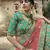 Green glitter dori, zari and thread embroidered with stone work satin semi stitched lehenga