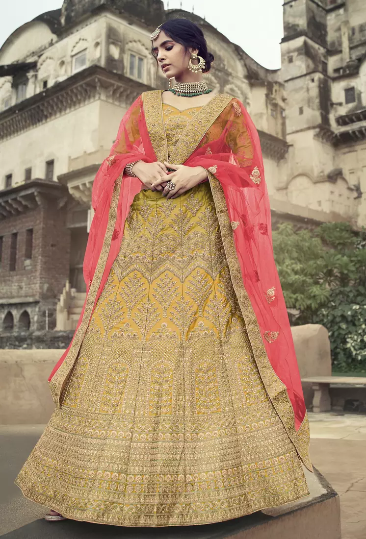 Yellow dori, zari and thread embroidered with stone work satin semi stitched lehenga