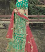 Green dori, zari and thread embroidered with stone work satin Semi Stitched Lehenga