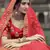 Red dori, zari and thread embroidered with stone work satin semi stitched lehenga