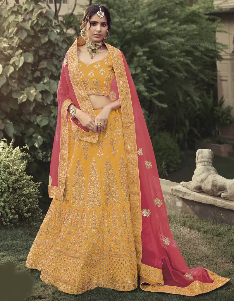 Yellow dori, zari and thread embroidered with stone work satin semi stitched lehenga