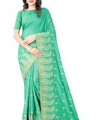 Light green vichitra silk embriodered saree with blouse piece.