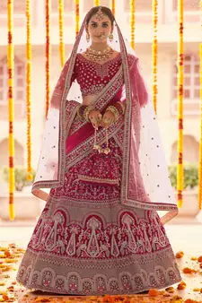 Pink Zari, zarkan, zardosi and thread embroidered velvet semi stitched wedding lehenga