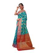 Green woven banarasi silk saree with blouse
