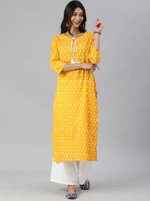 mustard and white ikkat printed straight kurta with dori and tassel detailing on neckline 1