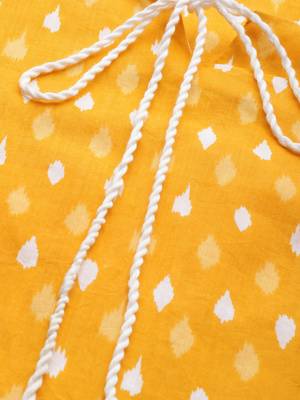 mustard and white ikkat printed straight kurta with dori and tassel detailing on neckline 4