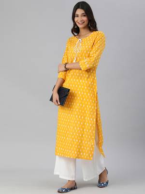 mustard and white ikkat printed straight kurta with dori and tassel detailing on neckline 5