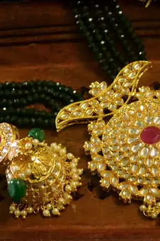 Green designer floral meenakari kundan studed onyx stone multilayer necklace set with earrings