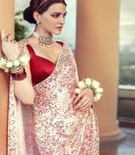 Red embroidered silk saree with blouse