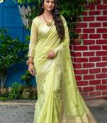 Dark green woven kanchipuram silk saree with blouse