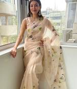 Cream printed organza saree with blouse