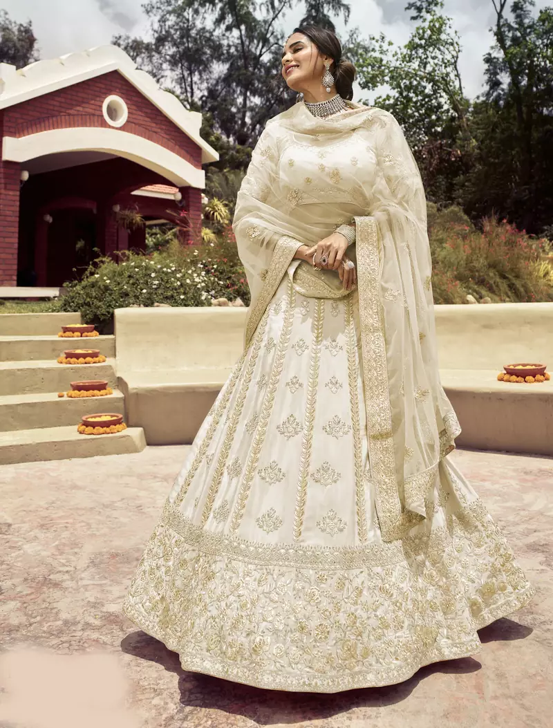 Entrancing Akaroa Off-white gota, zarkan, and resham embroidered crepe semi stitched Bridal lehenga