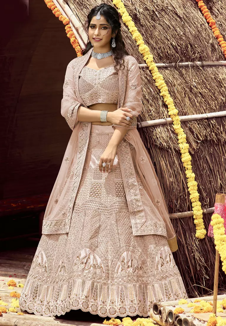 intriguing Beige zarkan, zari, and dori embroidered velvet semi stitched Dulhan lehenga