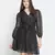Astute solid black celeb- style women shimmer tie knot dress