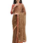 Beige embroidered chiffon saree with blouse