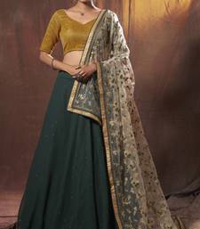 Mesmerizing Green golden zari sequins and thread embroidered georgette Lehenga choli