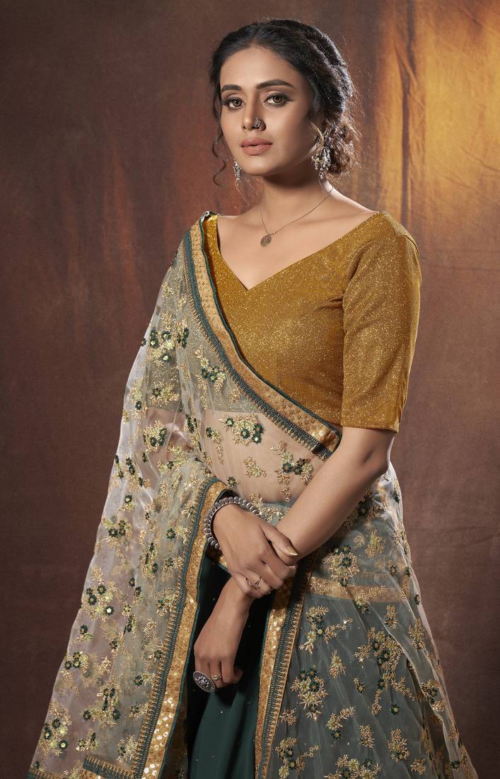 Mesmerizing Green golden zari, sequins and thread embroidered georgette Lehenga choli