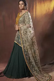 Mesmerizing Green golden zari, sequins and thread embroidered georgette Lehenga choli