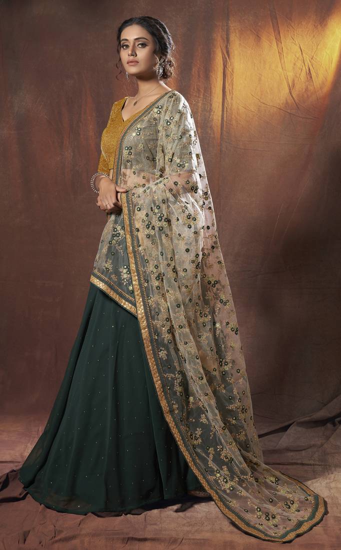 Mesmerizing Green golden zari, sequins and thread embroidered georgette Lehenga choli