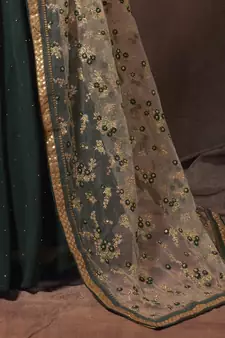 Mesmerizing Green golden zari, sequins and thread embroidered georgette Lehenga choli