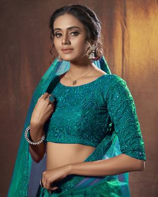 Bewitching Dark green thread embroidered net fabric lehenga choli 2