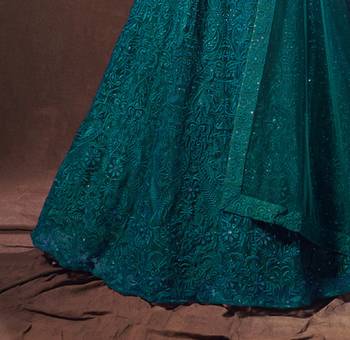 Bewitching Dark green thread embroidered net fabric lehenga choli 4
