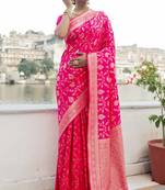 Rani pink woven silk blend saree with blouse