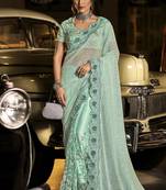 Sea green embroidered net saree with blouse
