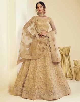 Golden embroidered net semi stitched lehenga 1