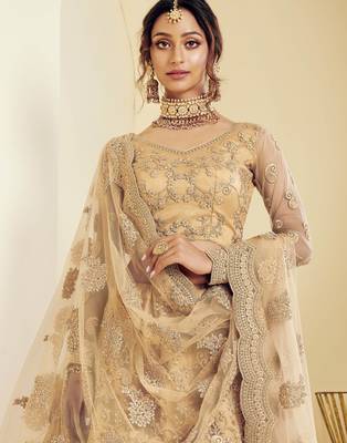 Golden embroidered net semi stitched lehenga 3