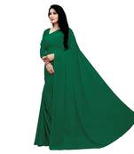 Dark green plain georgette saree with blouse